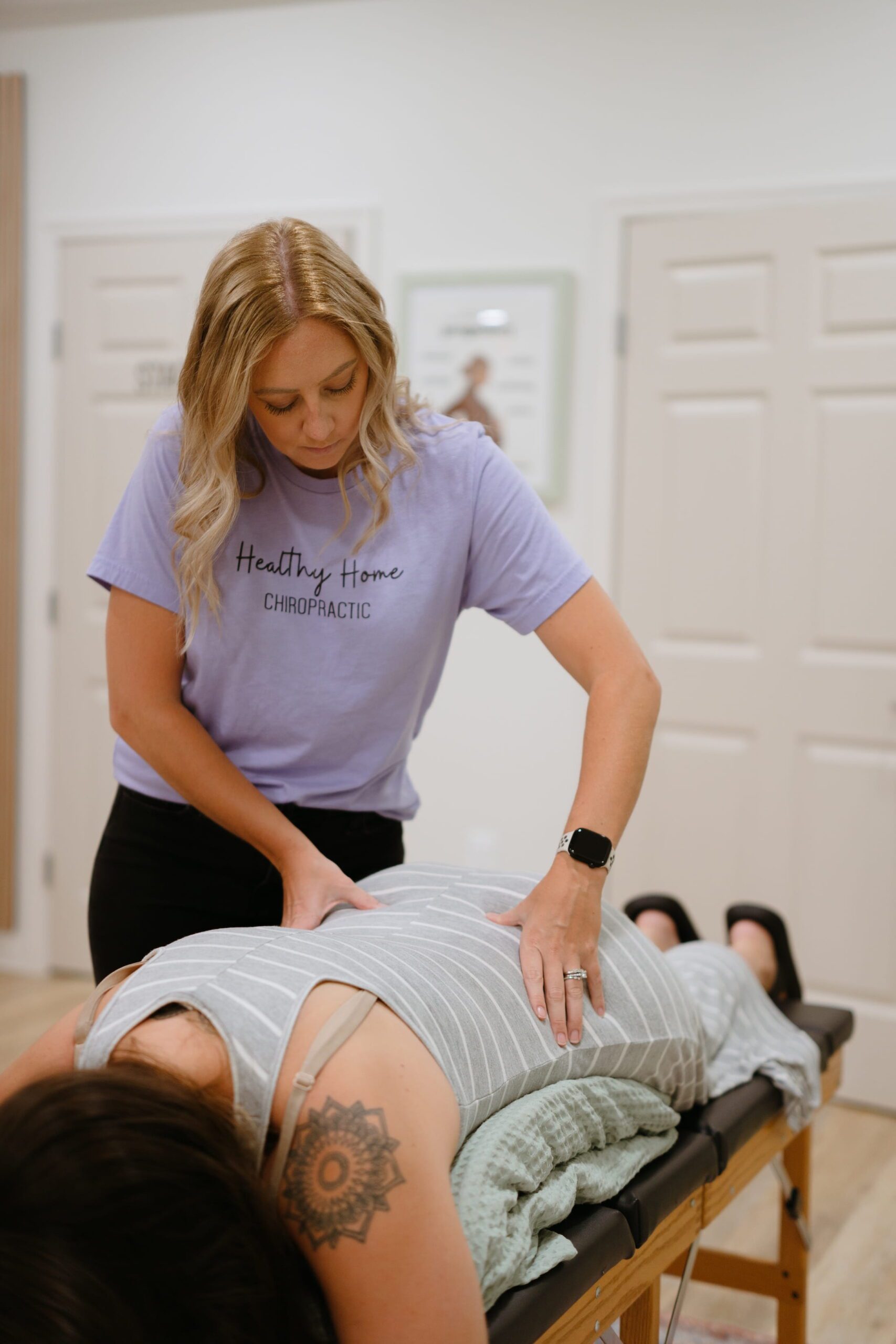 pregnant woman getting webster chiropractic adjustment