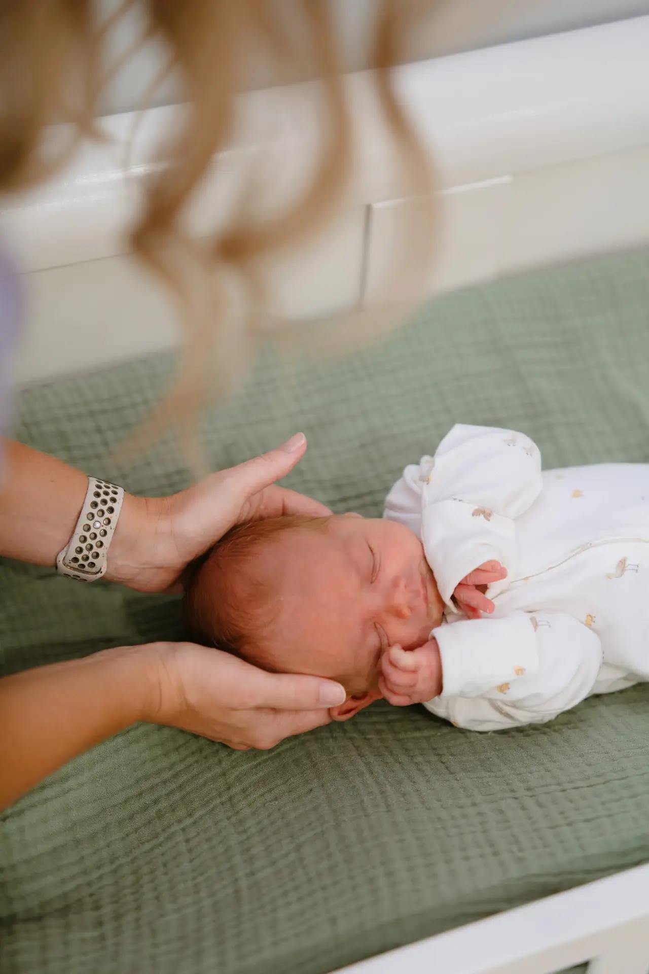 infant getting chiropractic adjustment